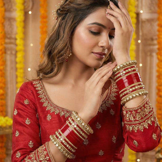 Contemplative Traditional Indian Bride in Red and Gold
