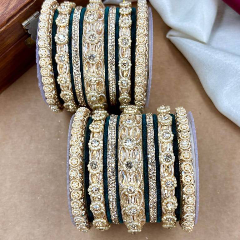Elegant South Asian Woman in Emerald Green Velvet and Gold Bangles