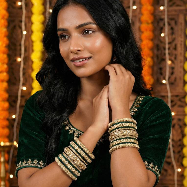 Elegant South Asian Woman in Emerald Green Velvet and Gold Bangles